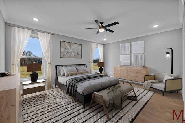 bedroom featuring recessed lighting, crown molding, a ceiling fan, and wood finished floors