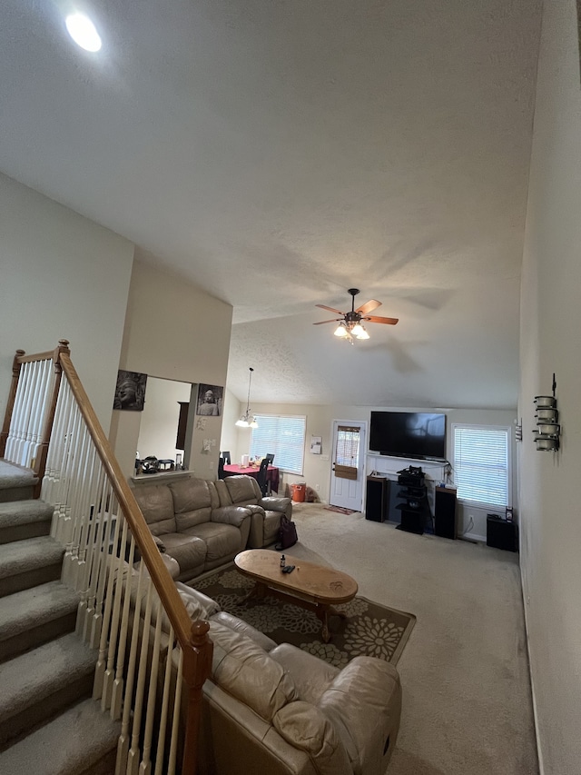 living room featuring ceiling fan and carpet flooring