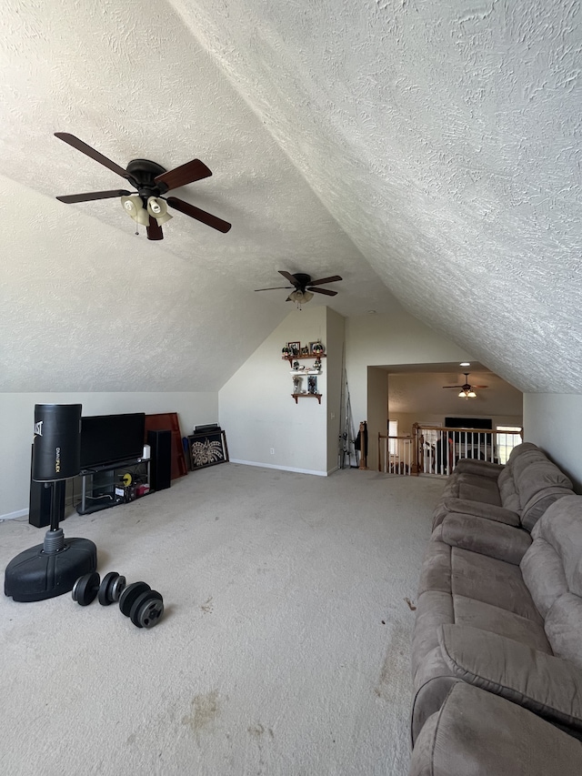 carpeted living room featuring a textured ceiling, ceiling fan, and lofted ceiling