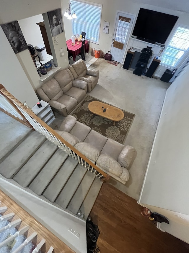 living room with hardwood / wood-style floors and an inviting chandelier