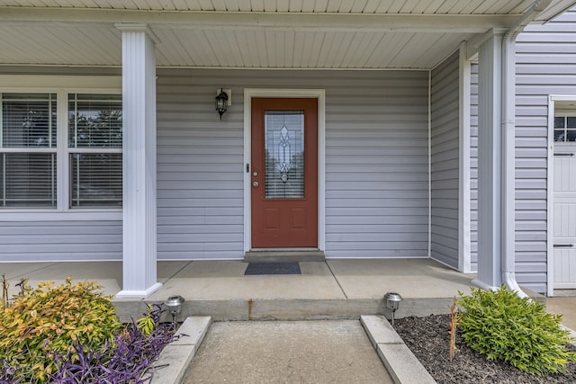 doorway to property featuring covered porch