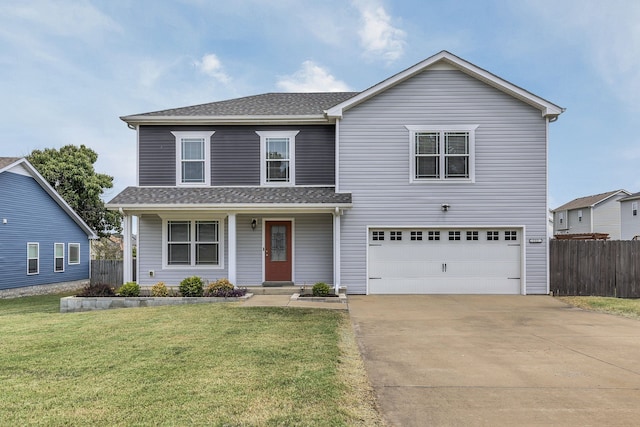 view of property with a front yard and a garage