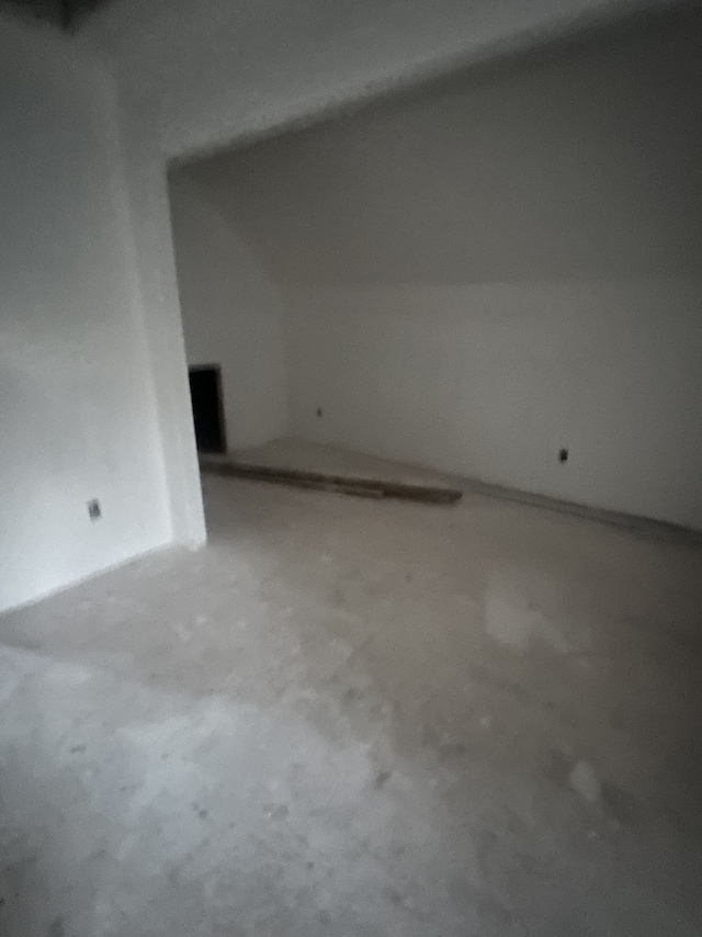 additional living space with concrete floors