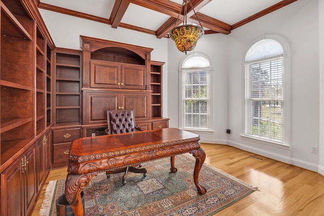 office area featuring coffered ceiling, crown molding, beamed ceiling, and light hardwood / wood-style flooring