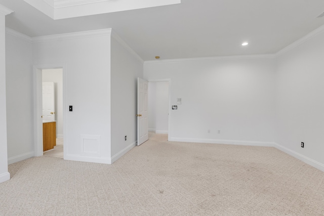 unfurnished bedroom featuring baseboards, ornamental molding, and light colored carpet