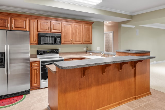 kitchen featuring stainless steel refrigerator with ice dispenser, electric range, light tile patterned flooring, a sink, and black microwave