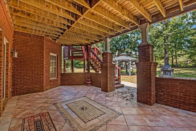 view of patio / terrace with a gazebo and an outdoor fire pit