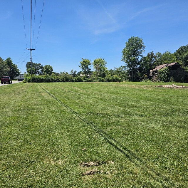 view of yard with a rural view