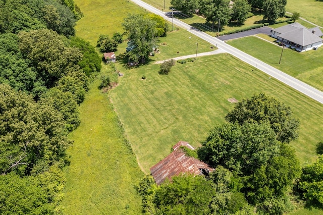 birds eye view of property with a rural view