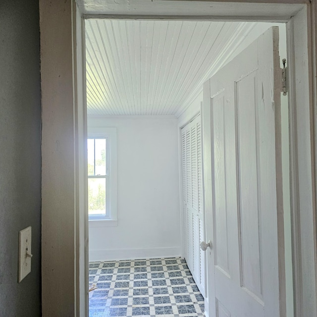 interior space with baseboards and tile patterned floors