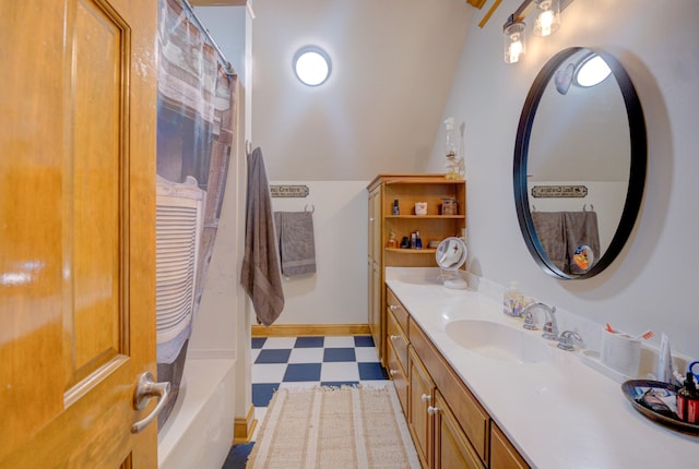 bathroom with tile patterned floors and vanity