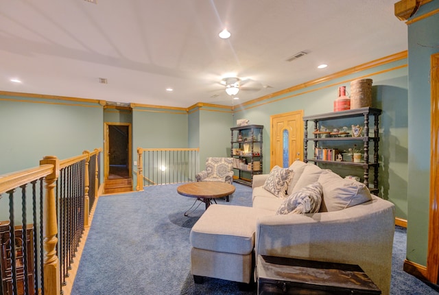 living room with ceiling fan, carpet, and ornamental molding