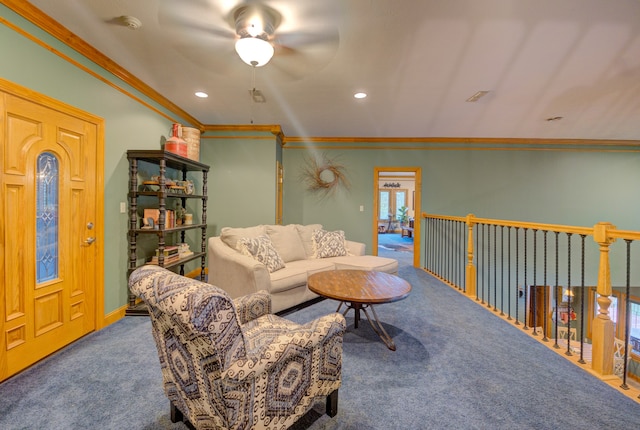 living room featuring ceiling fan, crown molding, and carpet floors