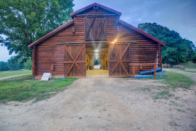 view of outdoor structure at dusk