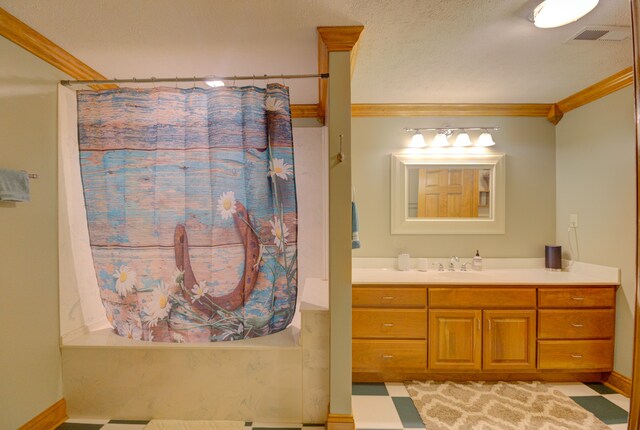 bathroom with crown molding, tile patterned floors, and vanity