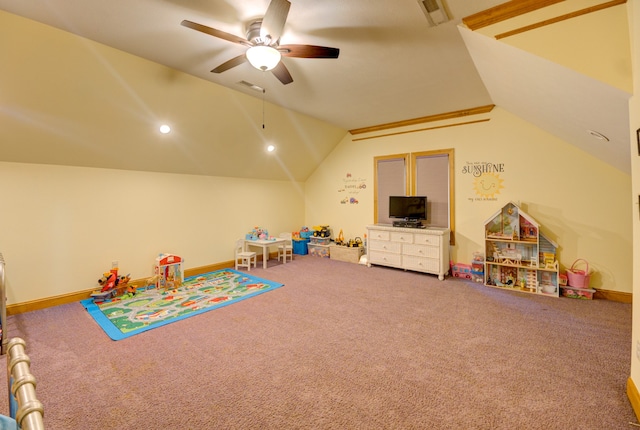 rec room with ceiling fan, carpet flooring, and vaulted ceiling