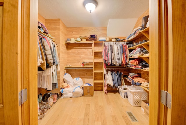 spacious closet with light wood-type flooring