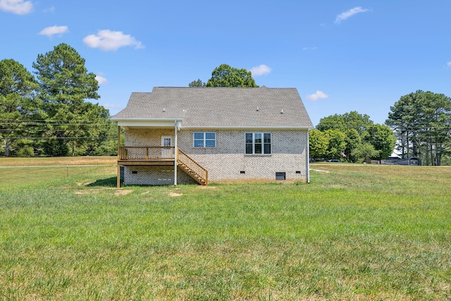 back of house with stairway, crawl space, a yard, a wooden deck, and brick siding