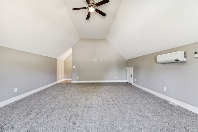 additional living space featuring a wall unit AC, ceiling fan, carpet floors, and vaulted ceiling