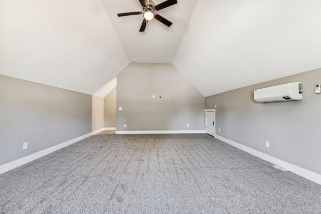 bonus room featuring ceiling fan, baseboards, vaulted ceiling, and a wall mounted AC