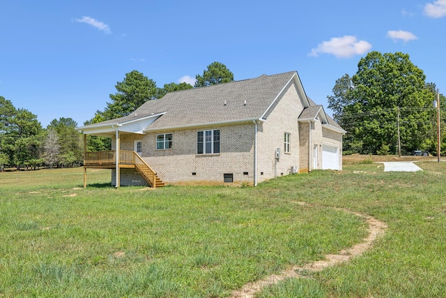 rear view of house with brick siding, a lawn, crawl space, a garage, and stairs