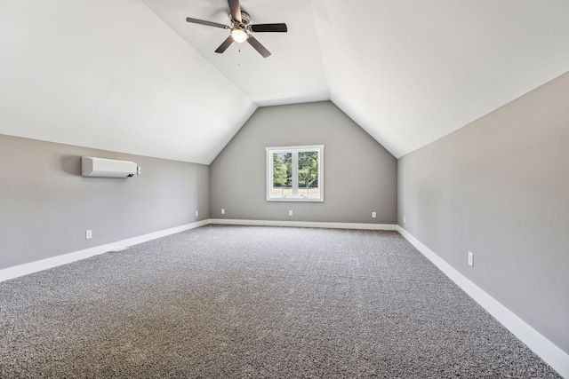 additional living space featuring baseboards, ceiling fan, carpet, vaulted ceiling, and a wall mounted AC