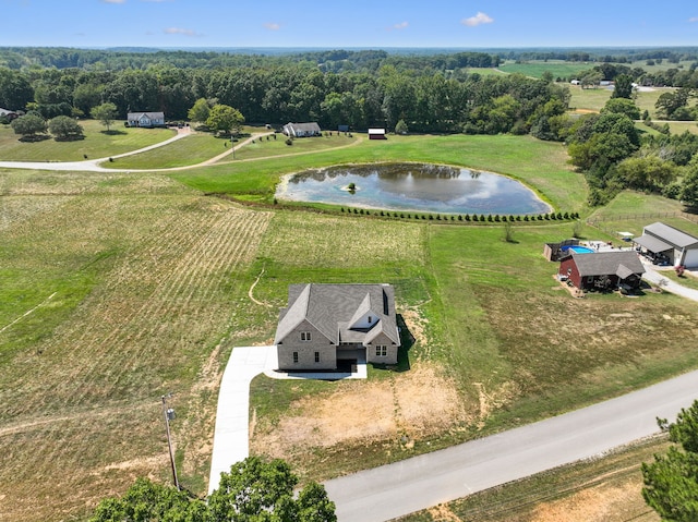 birds eye view of property featuring a rural view and a water view