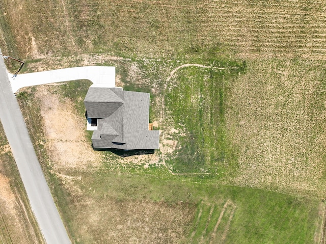 birds eye view of property with a rural view