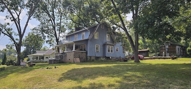 view of side of property with a yard