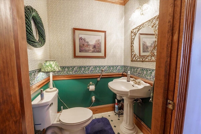 bathroom with toilet and tile patterned floors