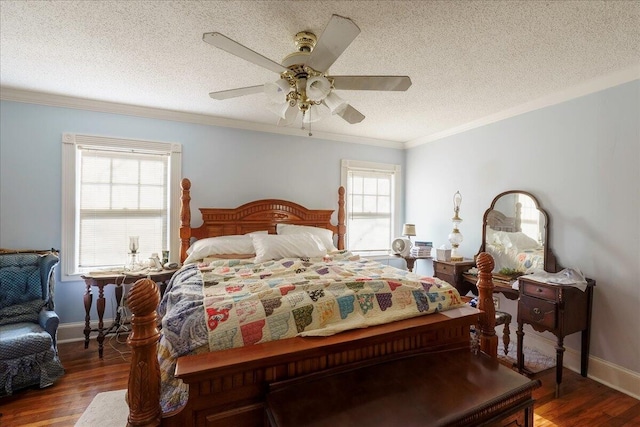 bedroom with ceiling fan, a textured ceiling, hardwood / wood-style floors, and ornamental molding