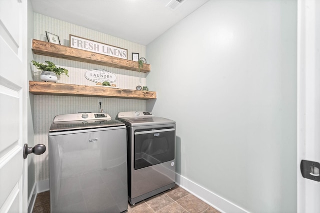 laundry area featuring washing machine and clothes dryer