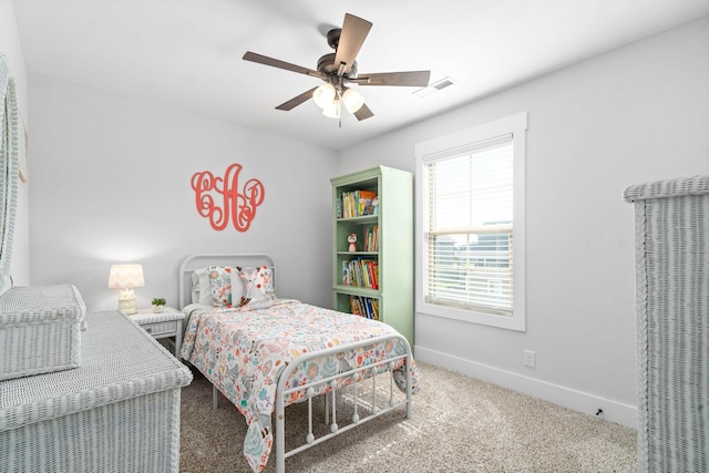 carpeted bedroom featuring ceiling fan