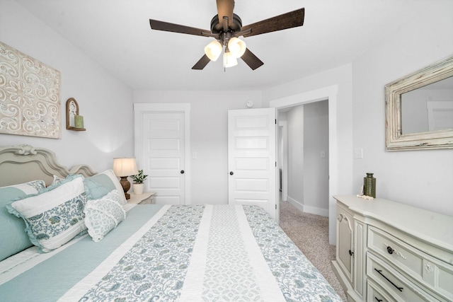 bedroom featuring ceiling fan and light carpet