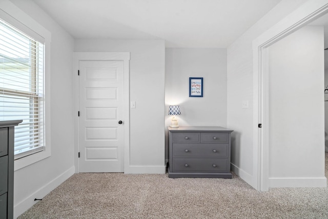 unfurnished bedroom with light carpet