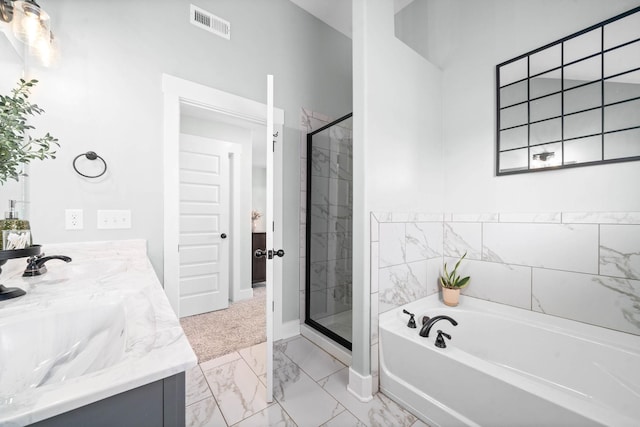 bathroom featuring separate shower and tub and vanity