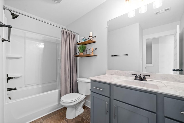 full bathroom featuring shower / bath combo with shower curtain, vanity, and toilet