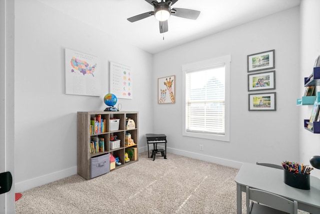 interior space featuring ceiling fan and carpet