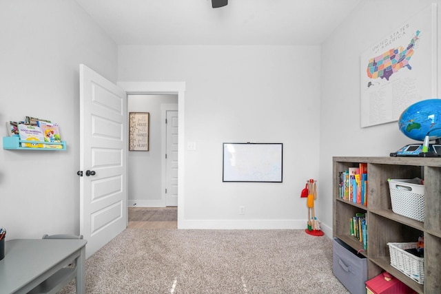 recreation room featuring light colored carpet