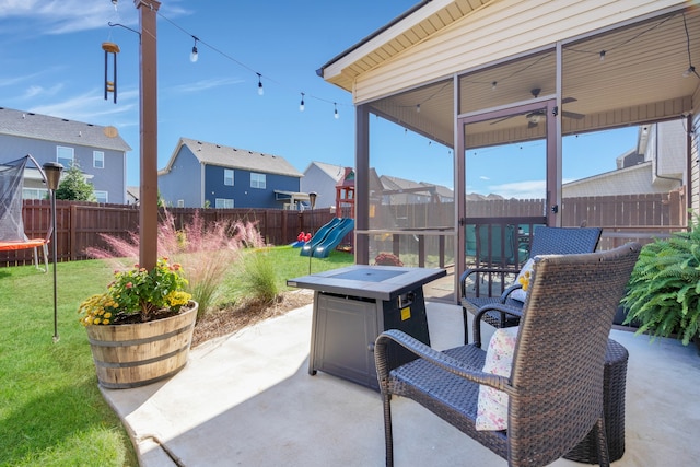 view of patio / terrace with a playground and a trampoline