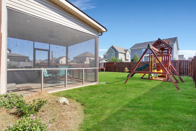 view of yard with a swimming pool, a playground, and a patio area