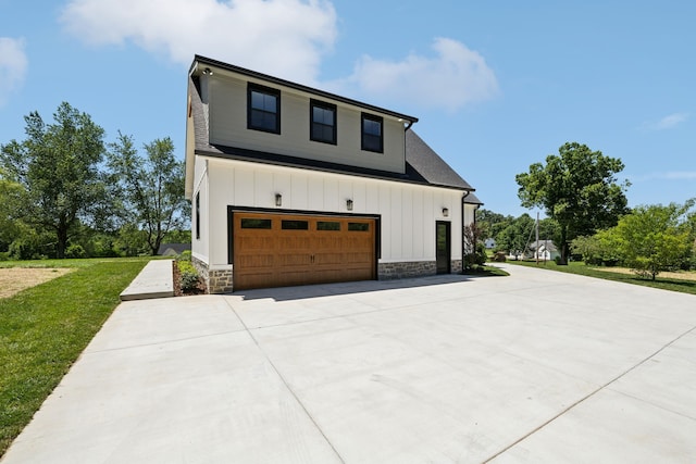 view of home's exterior featuring a garage and a lawn