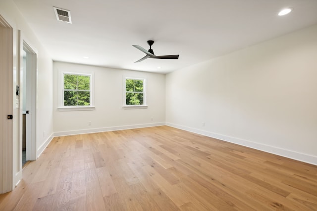 spare room with ceiling fan and light hardwood / wood-style floors