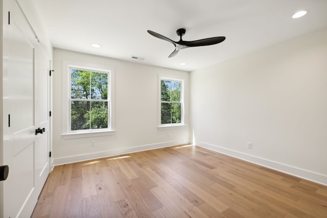 unfurnished room featuring ceiling fan and light hardwood / wood-style floors