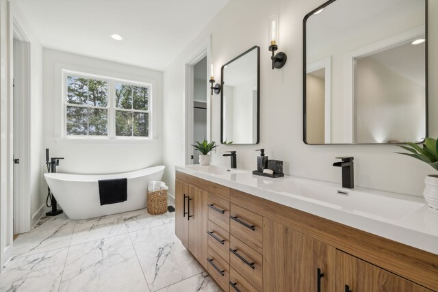 bathroom with dual bowl vanity and tile patterned flooring