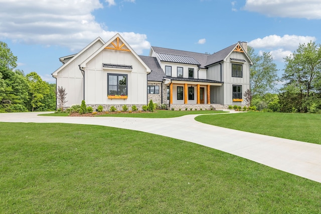 modern farmhouse featuring a front yard