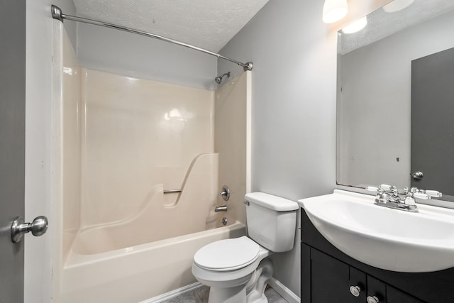 full bathroom featuring toilet, vanity, tile patterned floors, a textured ceiling, and bathtub / shower combination