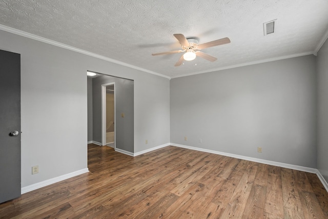 unfurnished room with ceiling fan, hardwood / wood-style flooring, ornamental molding, and a textured ceiling