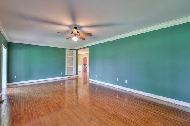 empty room with hardwood / wood-style flooring, ceiling fan, and ornamental molding