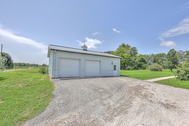 garage featuring a yard